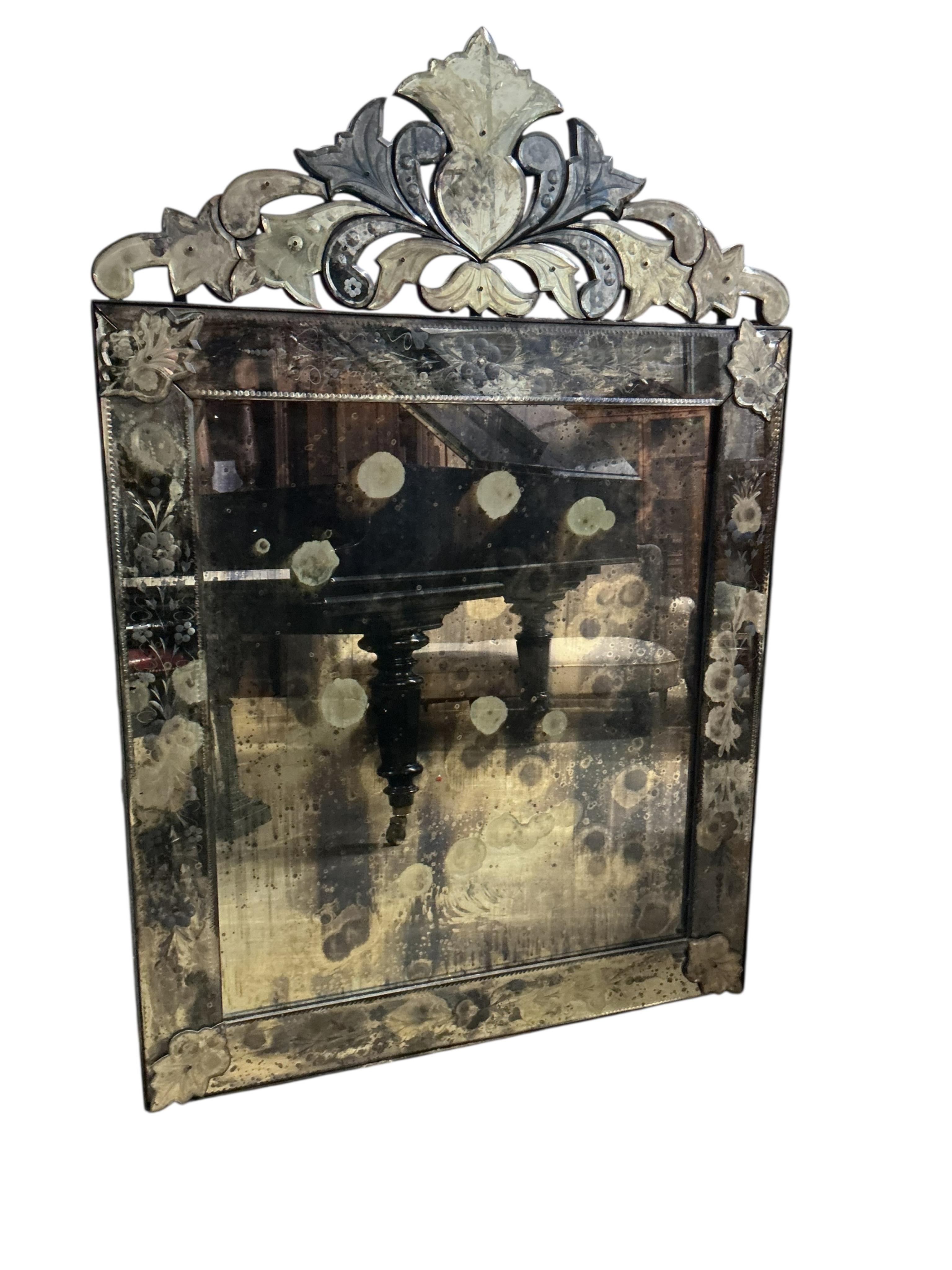 A Venetian wall mirror, width 92cm, height 136cm